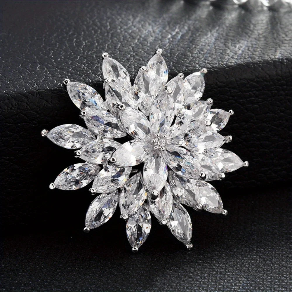 Silver Sparkling diamond flower brooch on a dark textured background