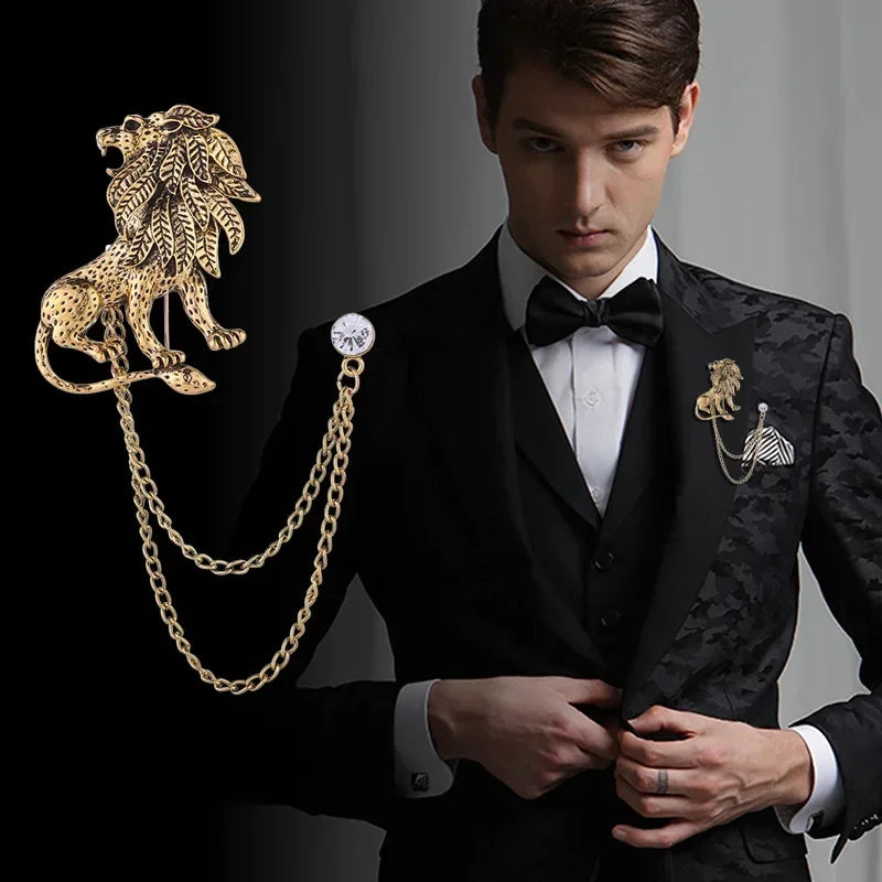 Man in a black suit with decorative brooches on a dark background