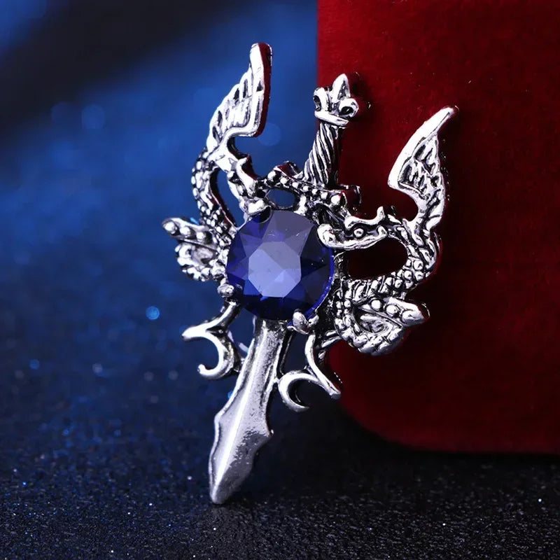 Silver brooch with blue gemstone elegant fashion lapel pin on dark background