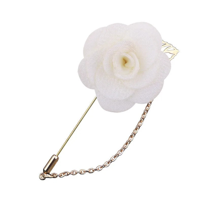 Beige flower shaped brooch with chain elegant fashion jewelry accessory on white background