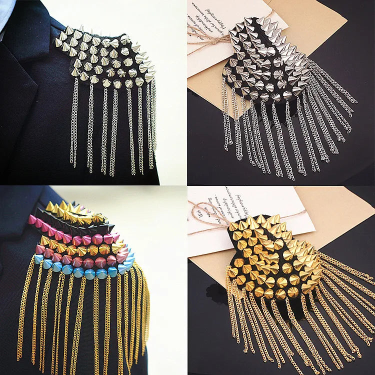 Collage of vintage tassel chain shoulder brooch pins on dark background