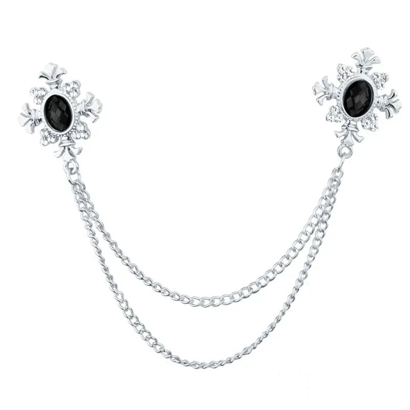 Silver Black Crystal cross chain brooch pins with gemstone accents on white background.