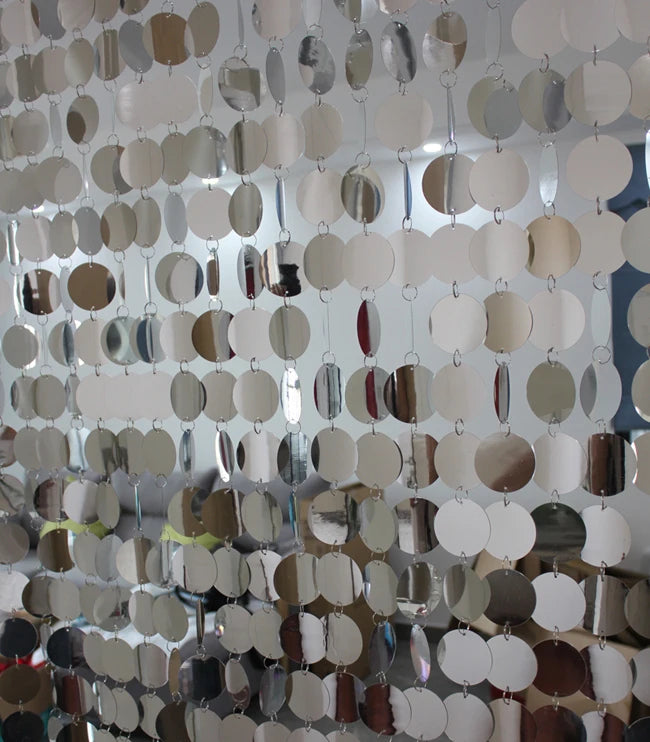 Metallic circular sequin curtain with reflective surface