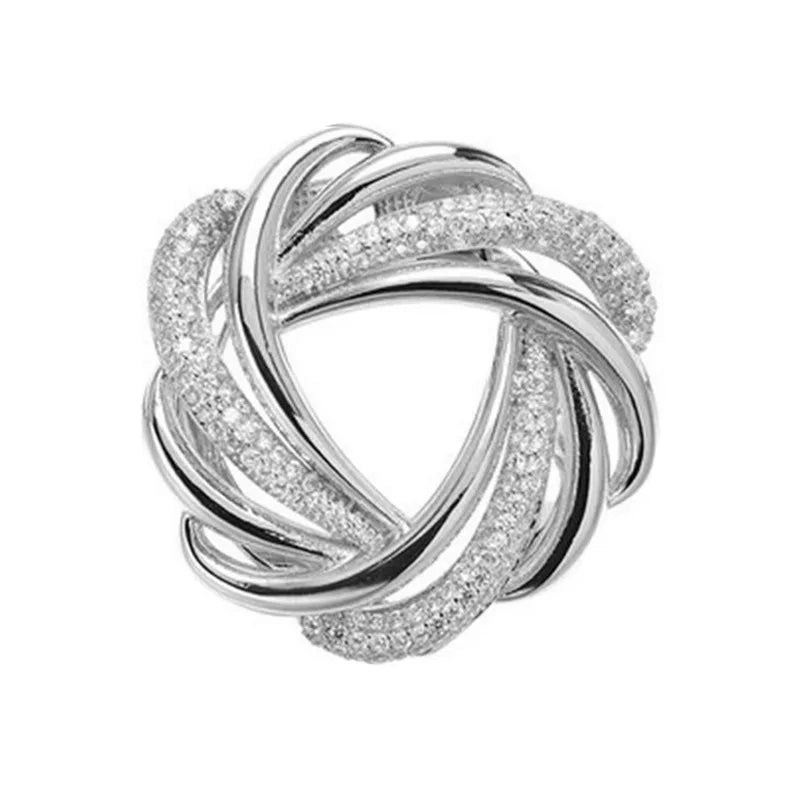 Silver interlocking ring jewelry piece elegant fashion accessory on soft white background