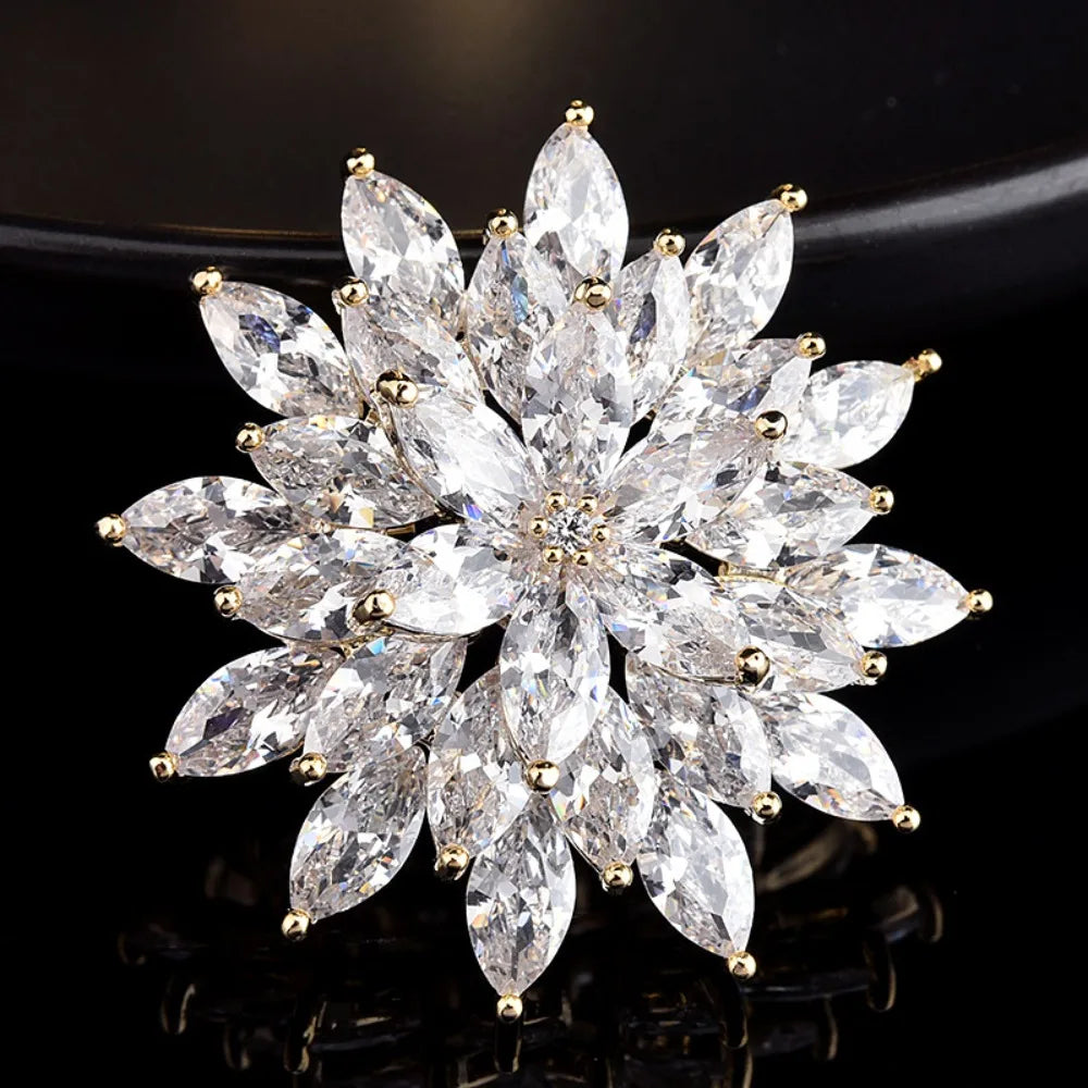 Sparkling crystal flower brooch on a black background