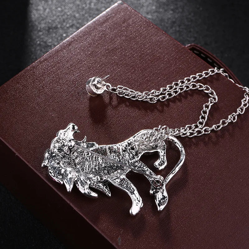 Silver Lion Brooch on a dark surface
