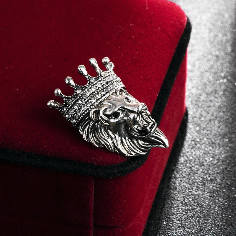Left side view of silver lion head brooch detailed luxury fashion accessory pin