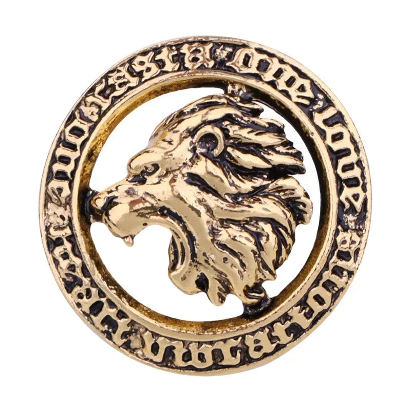 Round lion head emblem brooch on white background
