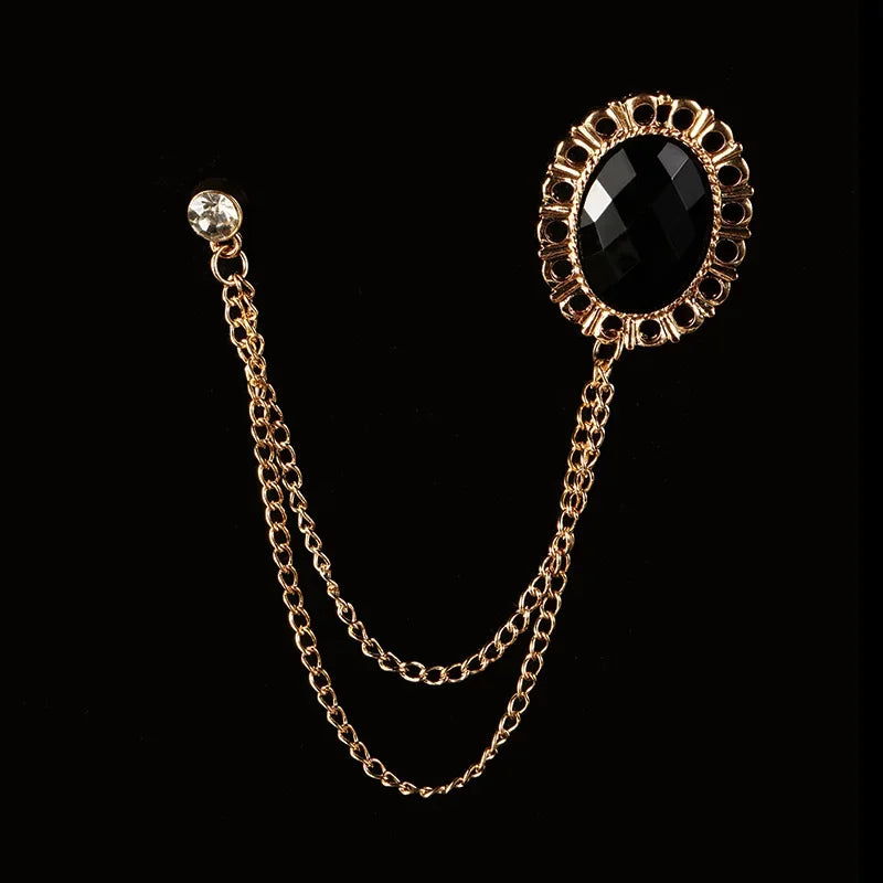 Gold brooch with black crystal gemstone luxury fashion accessory