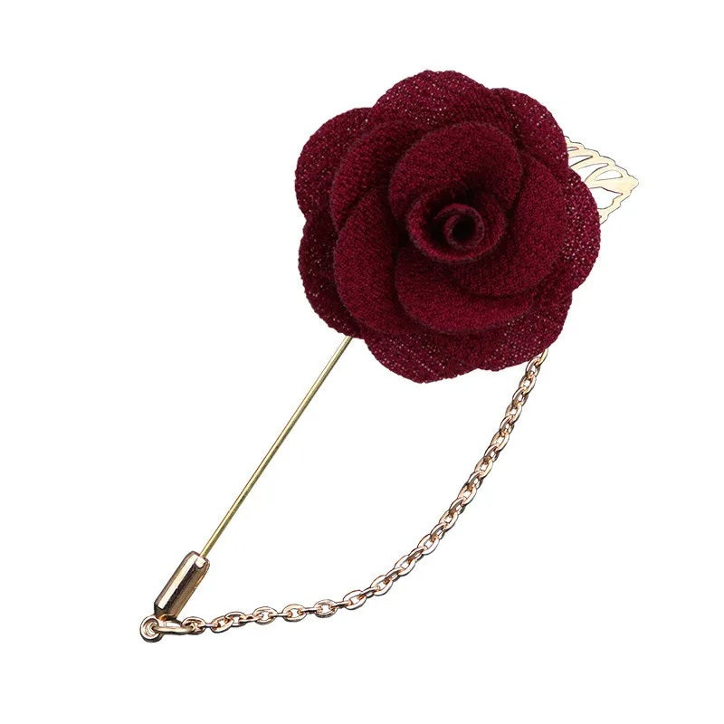 Deep red flower shaped brooch with chain elegant fashion jewelry accessory on white background