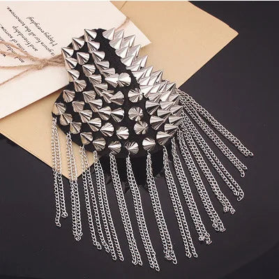 Silver studded fashion accessory with metallic chain fringe