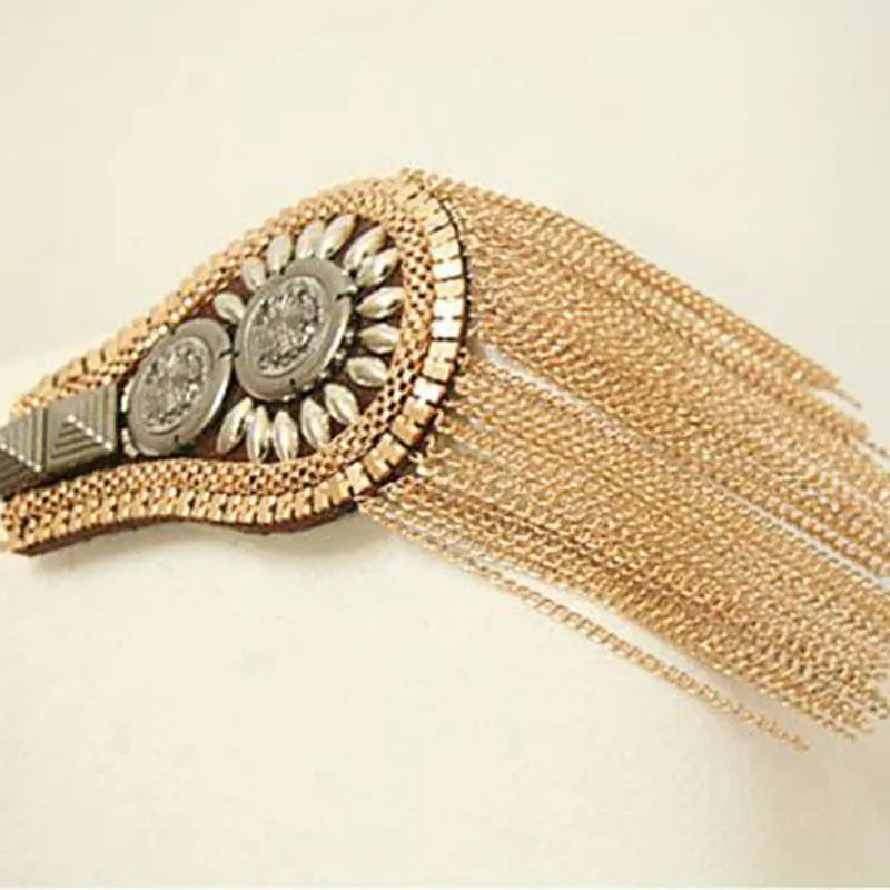 Decorative fashion brooch with chain tassels and circular embellishments
