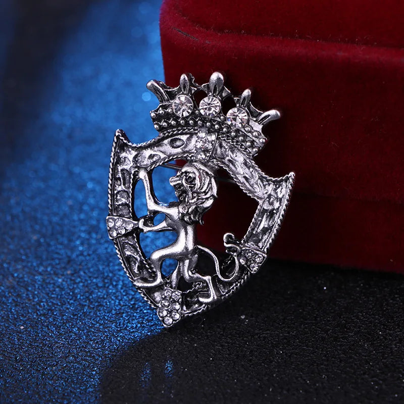Vintage silver lion brooch on premium blue and red background