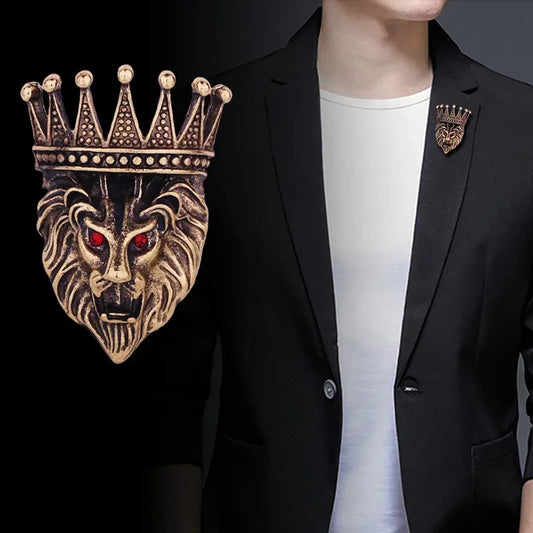 Person wearing black blazer with retro crown lion head brooch accessory