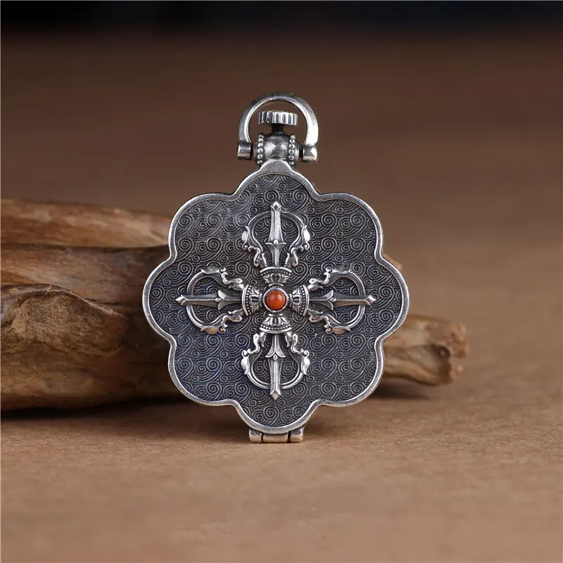 Vintage lotus flower keepsake pendant with symbolic engraved artwork