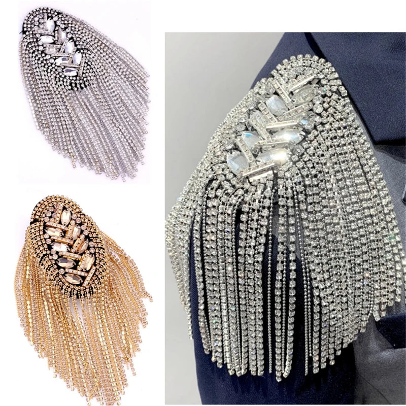 Rhinestone tassel brooch with gemstone detailing on plain background