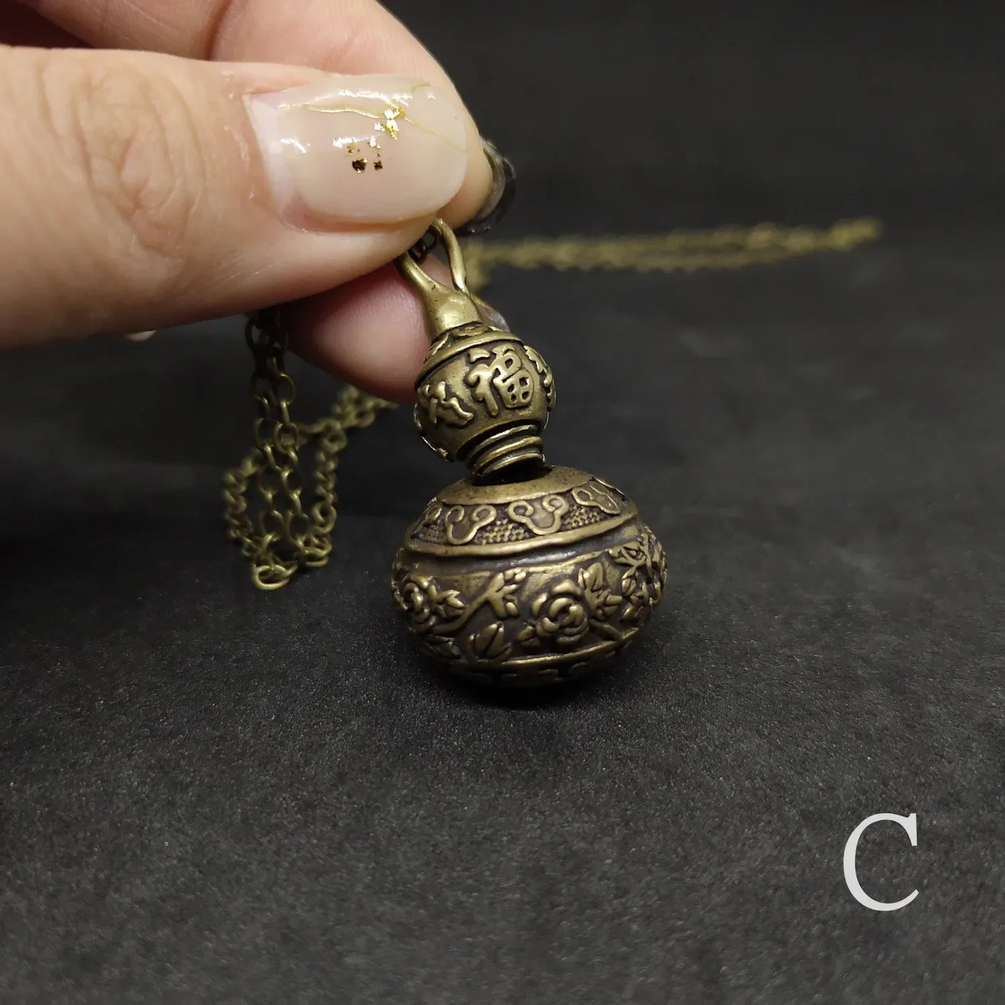 Antique calabash pendant necklace with screw top secret storage container