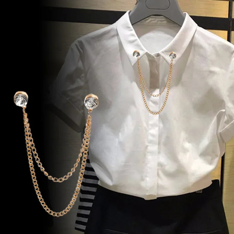 White shirt styled with gold double chain collar brooch accessory