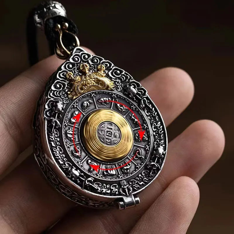 Oval Buddhist keepsake locket with Eight Treasures design with hand show