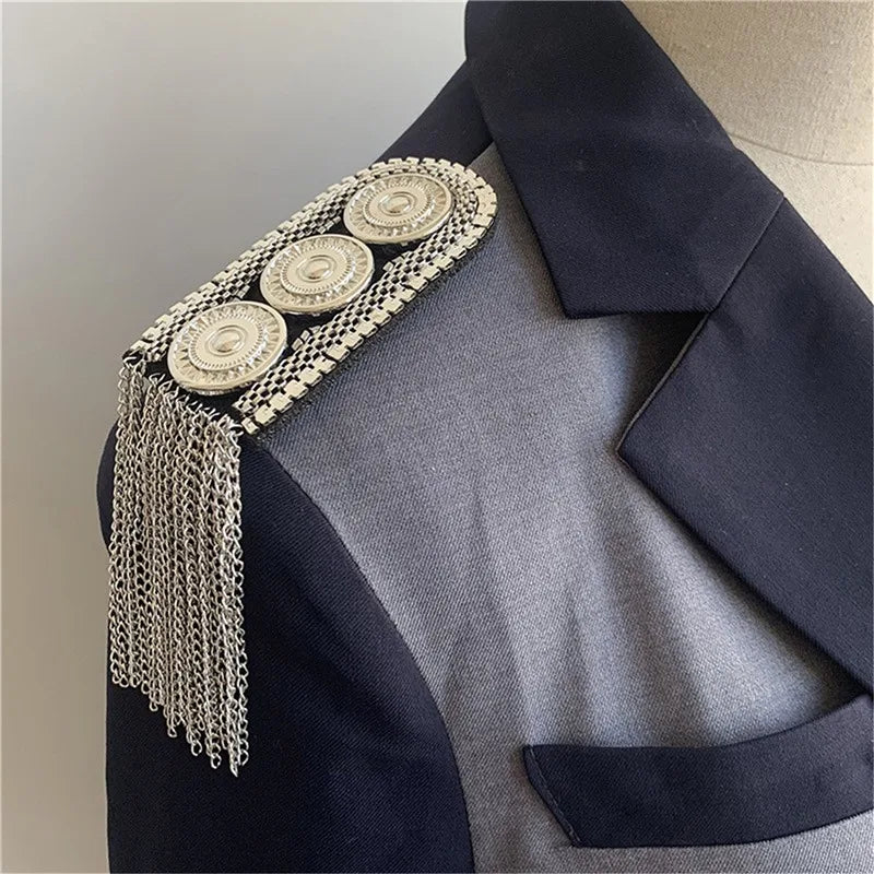 Navy blazer with gold tassel embellishment fashion accessory