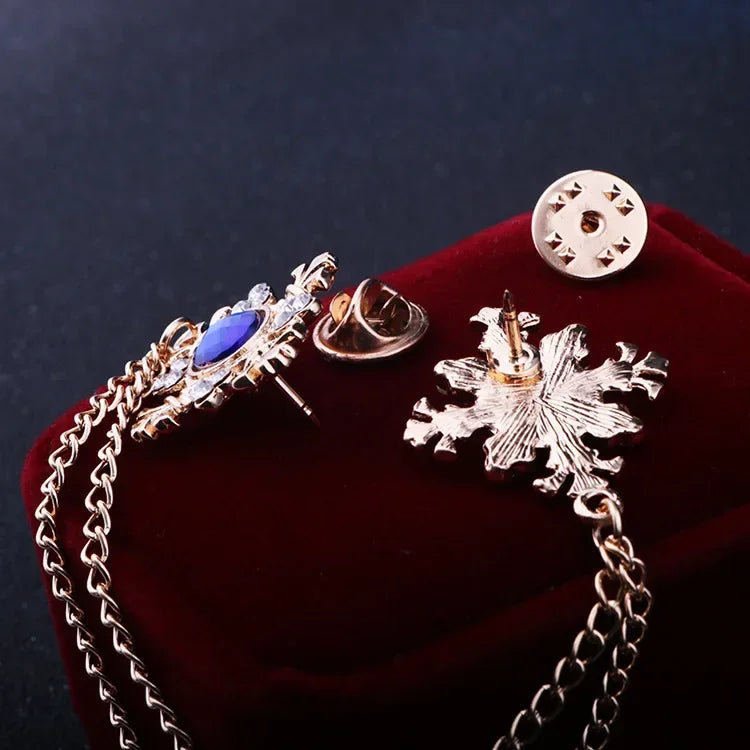 Back side view of crystal cross chain brooch showing secure pin fastening.