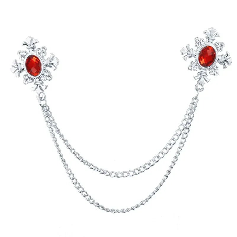Silver Red Crystal cross collar brooch with decorative chain design on white background.