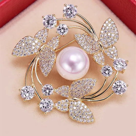 Elegant brooch with pearls and crystals on a red background