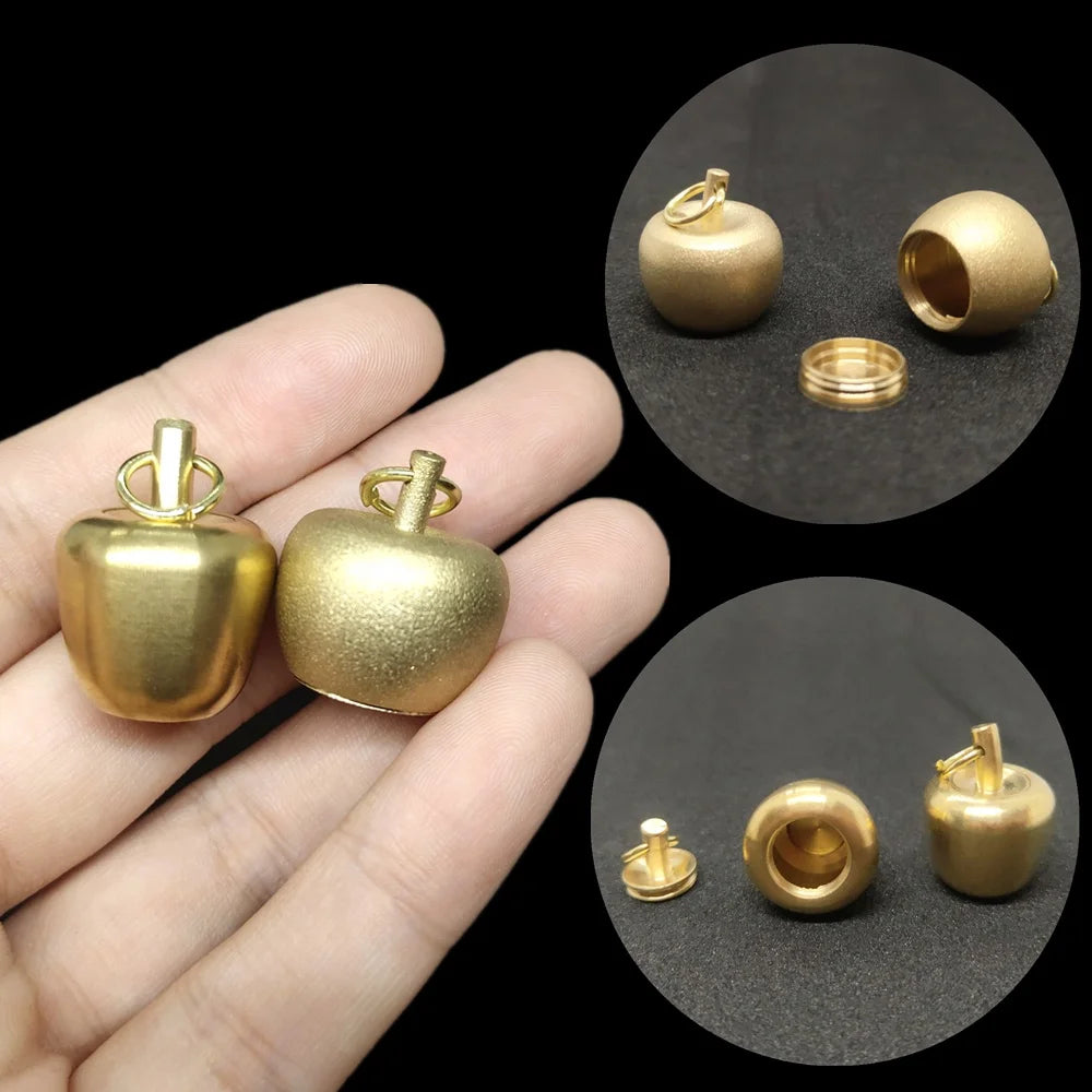 Gold apple-shaped brass pendant urn with openable storage compartment and detailed product showcase