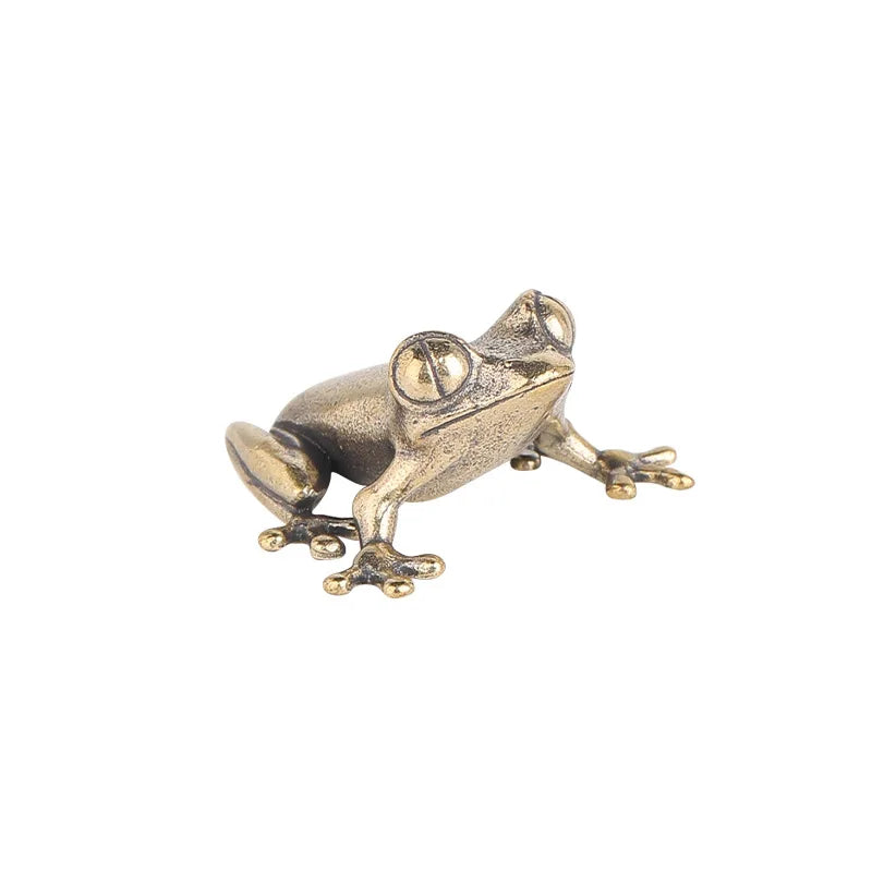frog figurine on a white background 