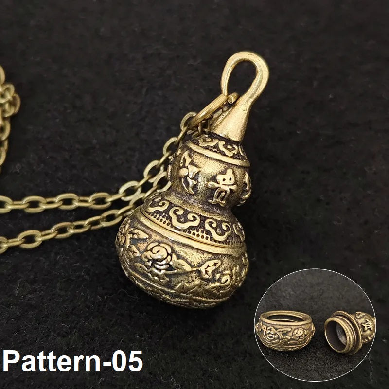 Antique-style brass gourd pendant with detailed cultural engraving design