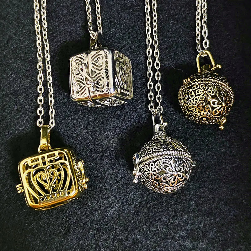 Vintage brass hollow ball locket pendant necklace with floral openwork design