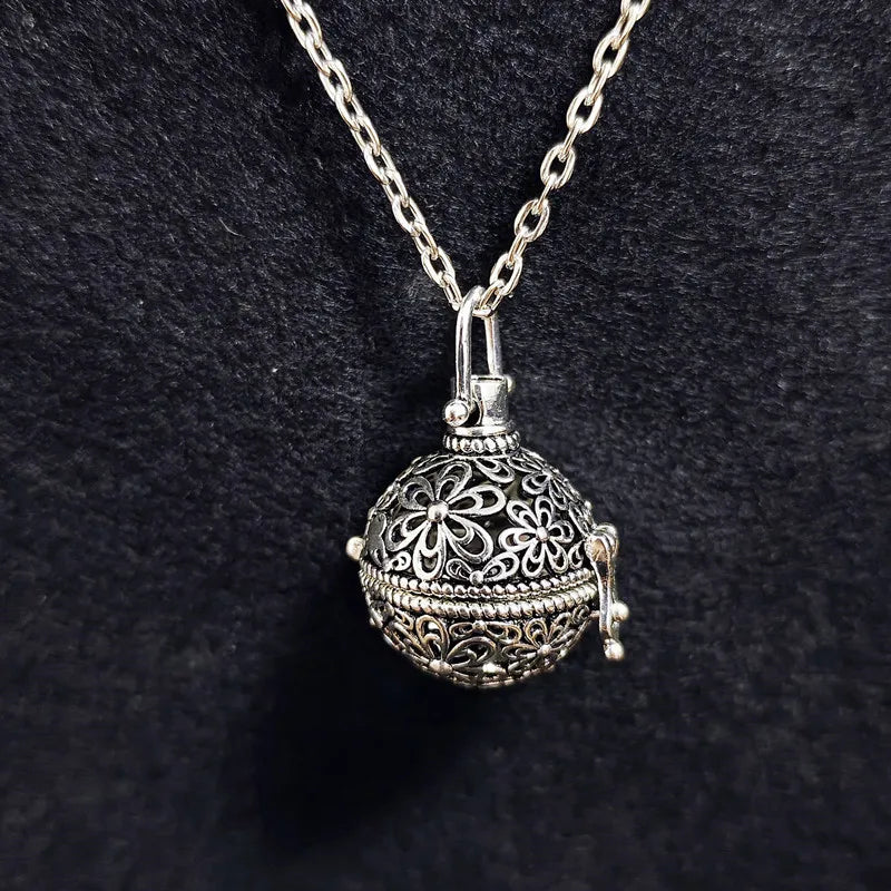 Vintage brass hollow ball locket pendant necklace with silver chain