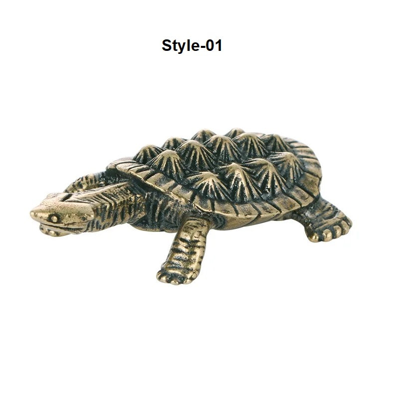 Bronze turtle figurine on a white background