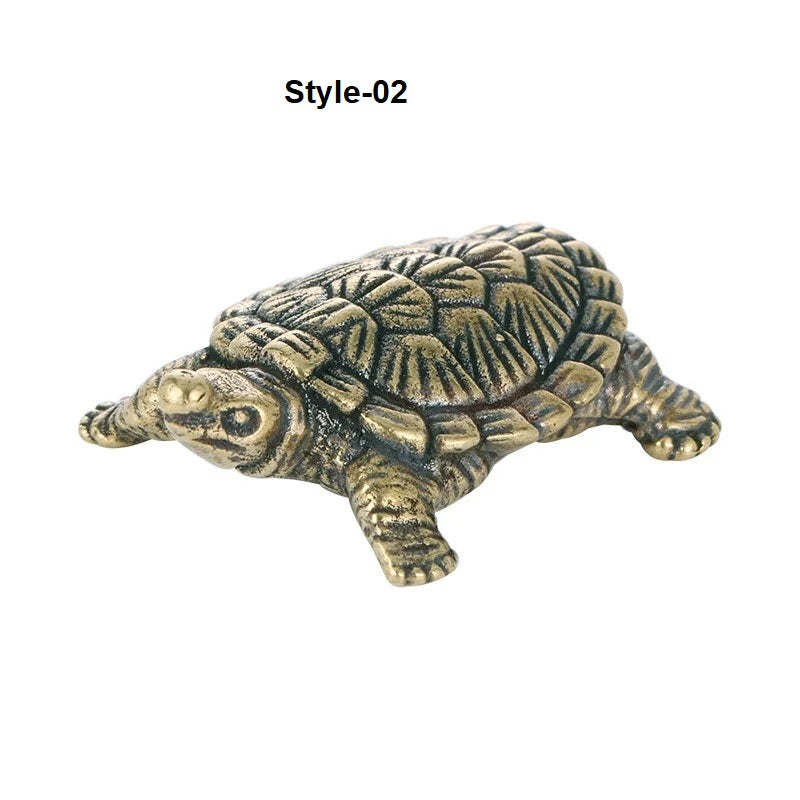 Bronze turtle figurine on a white background