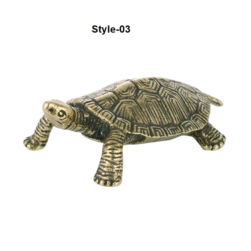 Bronze turtle figurine on a white background