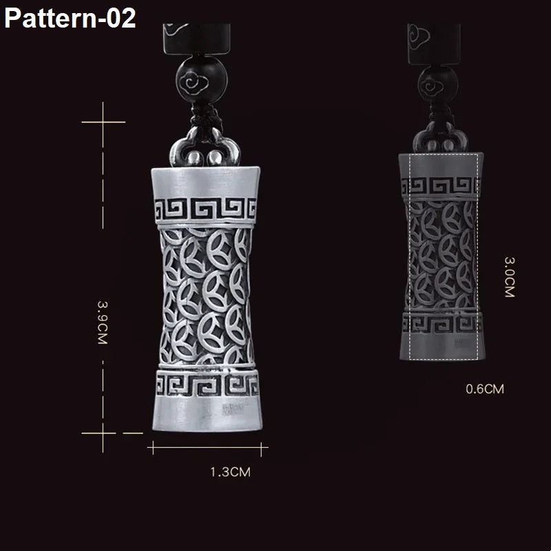 Decorative pendant with intricate patterns and measurements on a black background