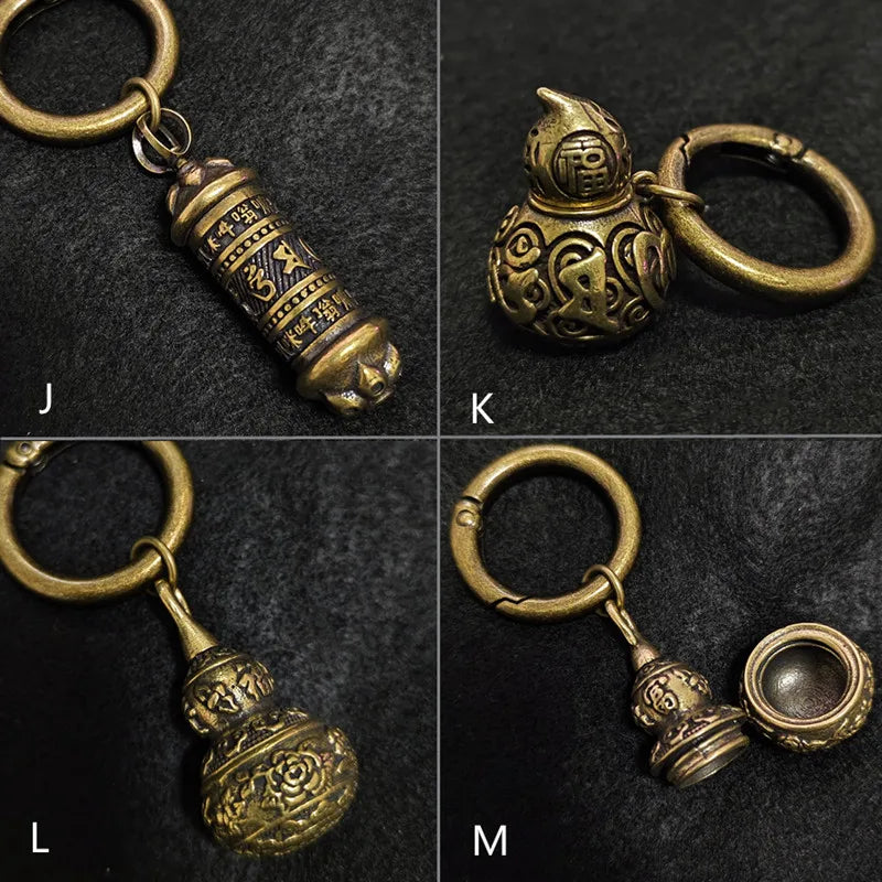 Assorted brass pendant keychains with antique bronze finish