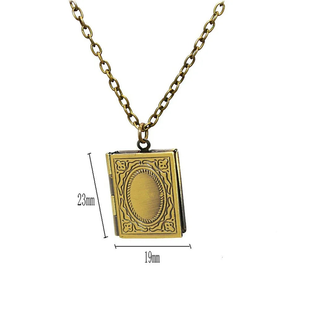 Vintage bronze memory book pendant with photo frame inside