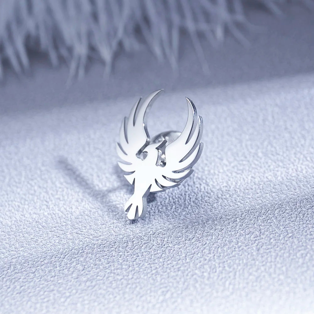 Silver bird shaped earring luxury fashion accessory with blurred background