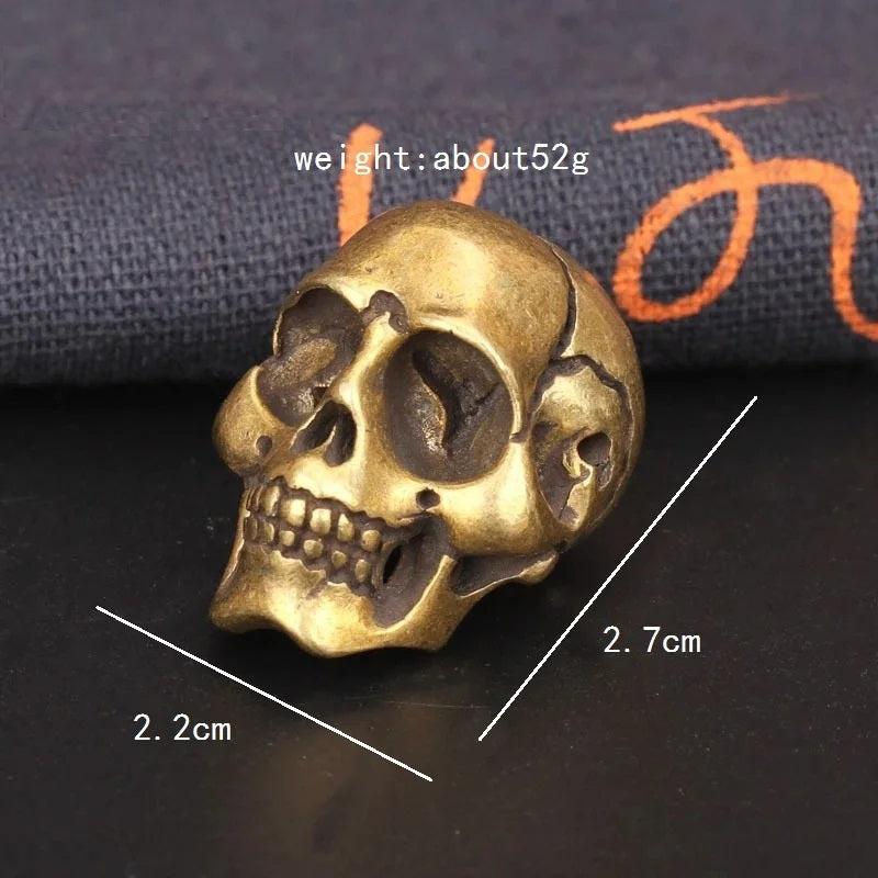 Solid brass skull head figurine with antique finish for gothic home decor, office desk decoration, and collectible display with size show