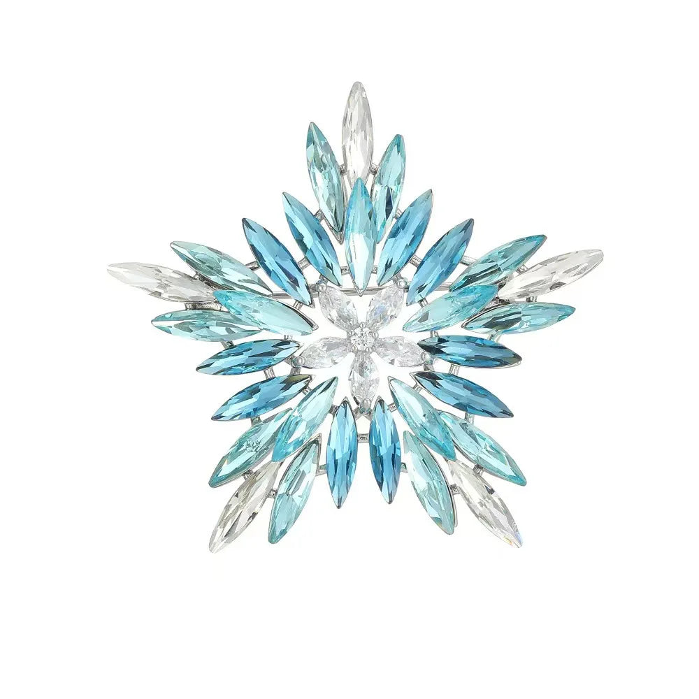 Decorative blue crystal snowflake brooch on white background
